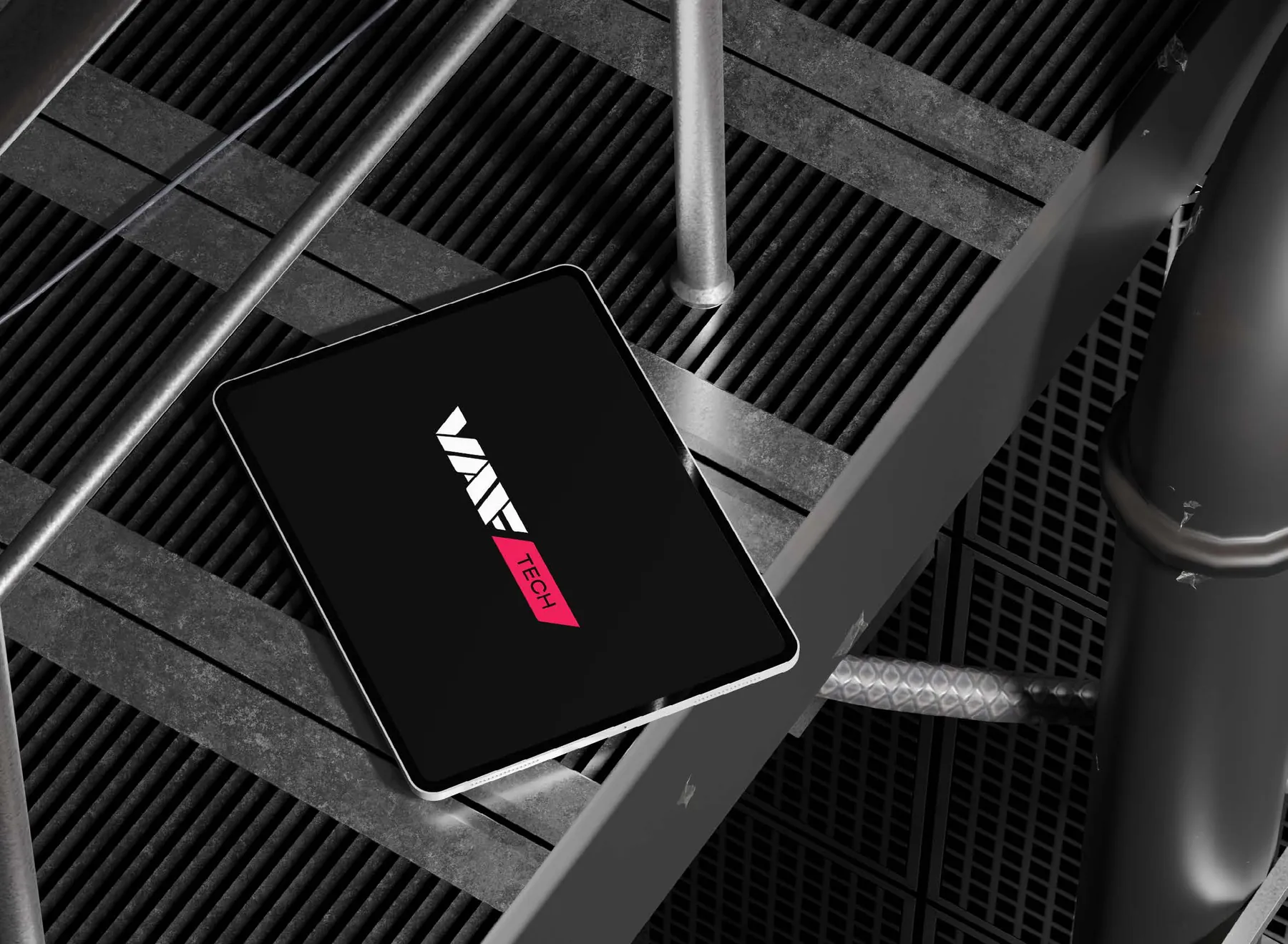 The new VAF Tech logo on a tablet lying on an industrial floor grate